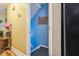 Hallway with blue wall leading to stairs at 1924 Strebor St, Durham, NC 27705