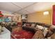 Open living and dining area with a comfortable sectional sofa, a cozy fireplace, and stylish decor at 1924 Strebor St, Durham, NC 27705