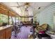 Spacious covered porch with ceiling fans, wood flooring, hammock and ample seating at 1924 Strebor St, Durham, NC 27705