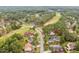 Residential aerial shot of houses in a lush golf community surrounded by trees at 200 Heather Brook Cir, Spring Lake, NC 28390