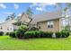 Charming home featuring a backyard deck, lush lawn, and manicured landscaping at 200 Heather Brook Cir, Spring Lake, NC 28390