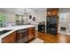 Kitchen with stainless steel appliances, a breakfast bar, and hardwood floors at 200 Heather Brook Cir, Spring Lake, NC 28390