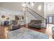 Spacious living room with soaring ceilings, staircase and hardwood floors, creating a welcoming and grand entrance at 200 Heather Brook Cir, Spring Lake, NC 28390