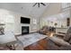 Open-concept living room with hardwood floors, fireplace, and a view of the dining area, great for entertaining at 200 Heather Brook Cir, Spring Lake, NC 28390