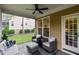 Relaxing screened patio with comfortable seating and a view of the yard at 200 Heather Brook Cir, Spring Lake, NC 28390