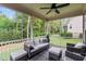 Screened patio with comfortable seating and views of the surrounding greenery at 200 Heather Brook Cir, Spring Lake, NC 28390