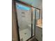 Bathroom featuring a glass enclosed shower with white marble tile and bench seat at 214 Alden Way, Angier, NC 27501