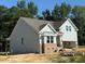 New construction home featuring a gray siding, a bay window, and a 2-car garage at 214 Alden Way, Angier, NC 27501