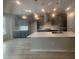 Modern kitchen featuring an island, stainless steel appliances, gray cabinets and white countertops and backsplash at 2207 Lambert Rd # 69, Cary, NC 27519