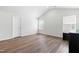 Spacious bedroom with wood floors, bright windows, and ample natural light at 224 Brisk Dr, Zebulon, NC 27597