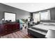 Stylish bedroom featuring modern decor, a comfortable bed, and a functional workspace at 224 Brisk Dr, Zebulon, NC 27597