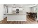 Bright kitchen with stainless steel appliances, tile backsplash, and granite countertops at 224 Brisk Dr, Zebulon, NC 27597