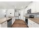 Stylish kitchen with granite countertops, stainless steel appliances, and ample cabinet space at 224 Brisk Dr, Zebulon, NC 27597