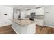 Well-equipped kitchen with a spacious island, modern appliances, and sleek finishes at 224 Brisk Dr, Zebulon, NC 27597