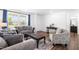 Comfortable living room with large windows, providing plenty of natural light and neighborhood views at 224 Brisk Dr, Zebulon, NC 27597