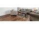 Well-decorated living room with hardwood floors, a patterned chair, and an ornate dark wood coffee table at 224 Brisk Dr, Zebulon, NC 27597