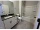 Bathroom featuring a white vanity, a dark countertop, a toilet, and a shower-tub combination at 2297 Bay Minette Sta # 536, Apex, NC 27502