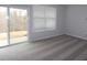 Bright bedroom featuring a sliding glass door to the outside, a window, and neutral carpet at 2297 Bay Minette Sta # 536, Apex, NC 27502