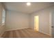 This spacious bedroom features neutral walls and carpet, with a window and a door leading to another room at 2297 Bay Minette Sta # 536, Apex, NC 27502