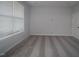 Bright bedroom featuring a window and neutral carpet at 2297 Bay Minette Sta # 536, Apex, NC 27502