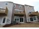 Townhome backyard view with a small deck or balcony overlooking the lawn and wooded area at 2297 Bay Minette Sta # 536, Apex, NC 27502