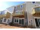 Townhome backyard view with a small deck or balcony overlooking the lawn and wooded area at 2297 Bay Minette Sta # 536, Apex, NC 27502