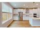 Gourmet kitchen with stainless steel appliances, and modern white cabinetry at 2297 Bay Minette Sta # 536, Apex, NC 27502