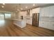 Open-concept kitchen with stainless steel appliances, pendant lighting, an island and views to the living area at 2297 Bay Minette Sta # 536, Apex, NC 27502