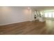 Open-concept living space with wood floors, connecting seamlessly to the kitchen for modern living at 2297 Bay Minette Sta # 536, Apex, NC 27502