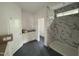 Bathroom featuring a marble shower and white cabinets at 2408 Eagle Shot Ct # 4, Fuquay Varina, NC 27526
