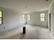 Spacious bedroom featuring several bright windows and neutral walls and flooring at 2408 Eagle Shot Ct # 4, Fuquay Varina, NC 27526