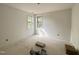 Bedroom with neutral walls and flooring and two bright windows at 2408 Eagle Shot Ct # 4, Fuquay Varina, NC 27526