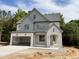 Beautiful new construction features a painted brick facade, attached garage, and landscaped yard at 2408 Eagle Shot Ct # 4, Fuquay Varina, NC 27526