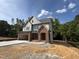 Stylish two-story home showcasing brick and siding exterior, with a two-car garage and a spacious front yard at 2408 Eagle Shot Ct # 4, Fuquay Varina, NC 27526
