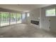Unfinished living room with fireplace, sliding doors to deck, and natural light at 2408 Eagle Shot Ct # 4, Fuquay Varina, NC 27526