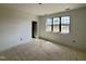 Bright, unfinished room with a large window and doorway at 2408 Eagle Shot Ct # 4, Fuquay Varina, NC 27526