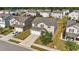 Aerial view of home, showing the manicured lawn, driveway, and surrounding neighborhood at 2522 Dalmahoy Ln, Fuquay Varina, NC 27526
