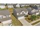 Aerial view of home, showcasing the lawn, driveway, and surrounding neighborhood at 2522 Dalmahoy Ln, Fuquay Varina, NC 27526