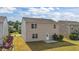 Exterior rear of home showcasing a yard and patio area at 2522 Dalmahoy Ln, Fuquay Varina, NC 27526