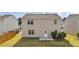 Exterior rear of home showcasing a yard and patio area at 2522 Dalmahoy Ln, Fuquay Varina, NC 27526