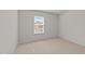 Bedroom featuring a window that provides natural light and plush carpeting at 2522 Dalmahoy Ln, Fuquay Varina, NC 27526