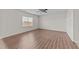 Spacious bedroom features wood-look flooring, white walls, and a bright window at 2522 Dalmahoy Ln, Fuquay Varina, NC 27526