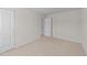 Neutral bedroom featuring a carpet floor, closet and adjoining doorway at 2522 Dalmahoy Ln, Fuquay Varina, NC 27526