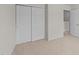 Bedroom features sliding closet doors and access to the hallway at 2522 Dalmahoy Ln, Fuquay Varina, NC 27526