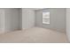 Bedroom features a sunlit window and soft carpeting at 2522 Dalmahoy Ln, Fuquay Varina, NC 27526