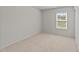 Bedroom features plush carpet and a window offering natural light at 2522 Dalmahoy Ln, Fuquay Varina, NC 27526