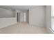 Bonus room features neutral walls and flooring along with a sunlit window at 2522 Dalmahoy Ln, Fuquay Varina, NC 27526