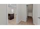 View from the hallway into the kitchen with central island at 2522 Dalmahoy Ln, Fuquay Varina, NC 27526