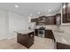 Bright kitchen featuring stainless steel appliances, granite countertops, and central island at 2522 Dalmahoy Ln, Fuquay Varina, NC 27526