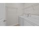 Laundry room with washer, dryer, and wire shelving for convenient storage at 2522 Dalmahoy Ln, Fuquay Varina, NC 27526